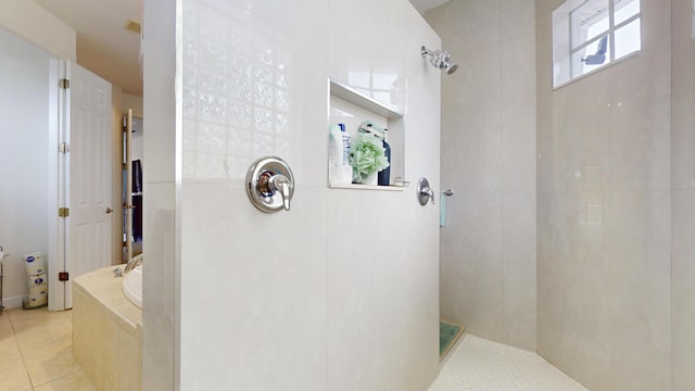 bathroom with tile patterned floors and shower with separate bathtub