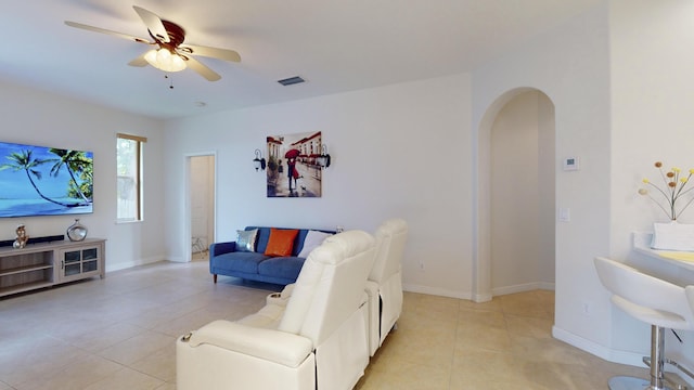 living room featuring ceiling fan and light tile patterned floors