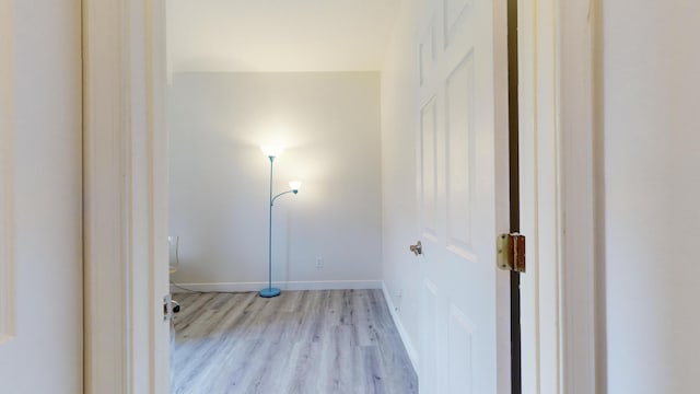 laundry room featuring light hardwood / wood-style flooring