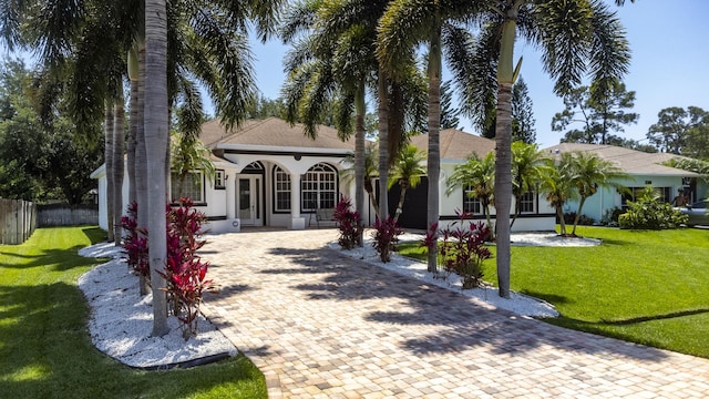 view of front of home with covered porch and a front yard