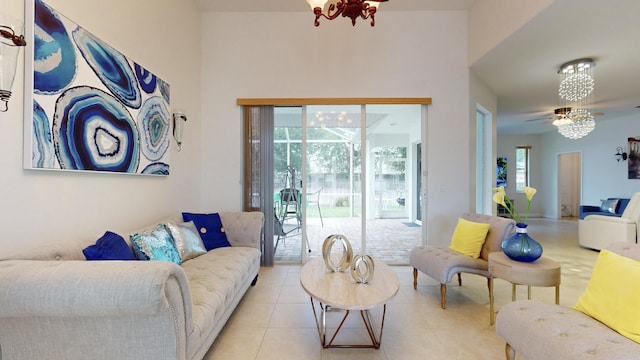 tiled living room with an inviting chandelier