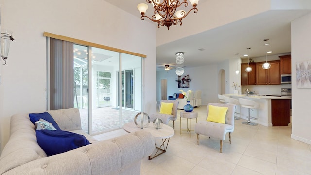 tiled living room featuring sink and an inviting chandelier