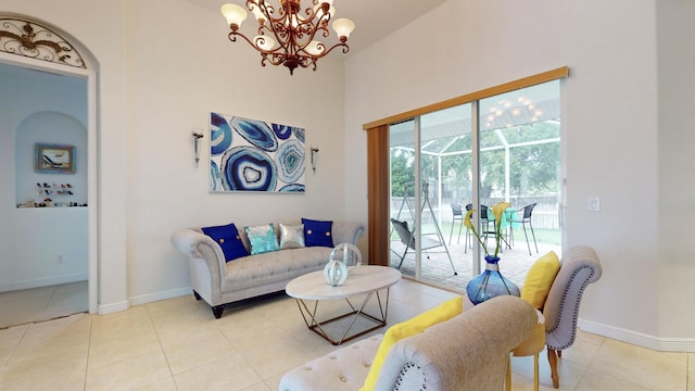 tiled living room featuring an inviting chandelier