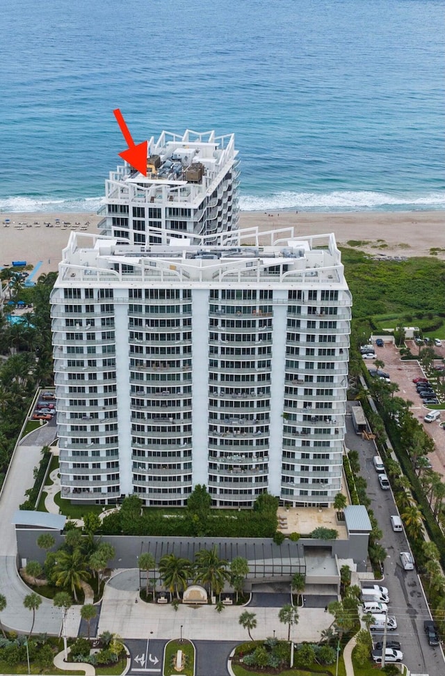 aerial view with a view of the beach and a water view