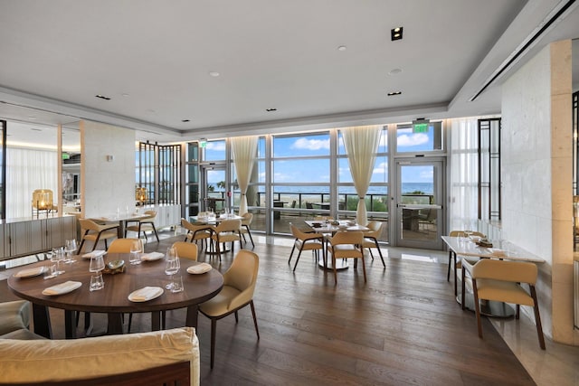 dining room featuring hardwood / wood-style flooring and floor to ceiling windows