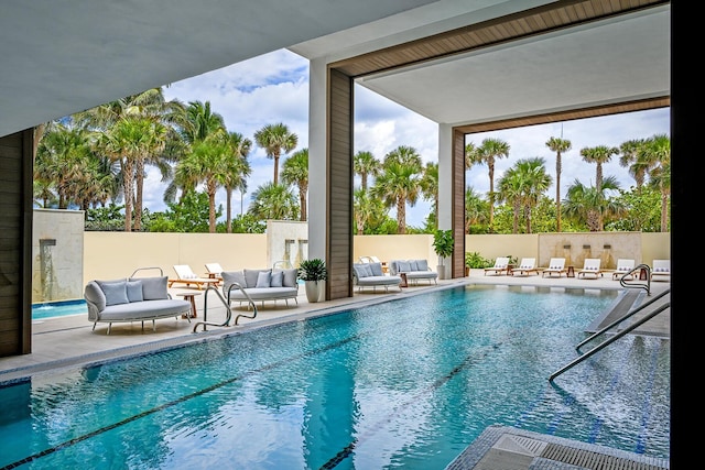 view of pool with a patio area and outdoor lounge area