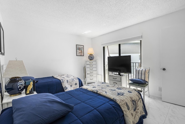 bedroom featuring a textured ceiling