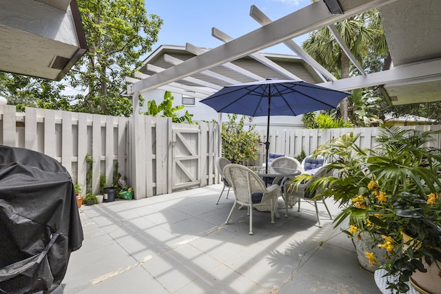 view of patio with a pergola and grilling area