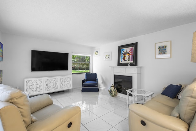 tiled living room featuring a textured ceiling