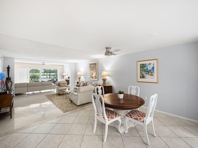 tiled dining room with ceiling fan