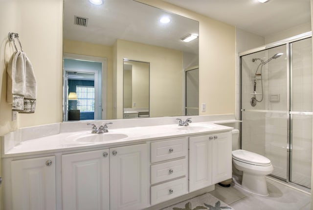 bathroom featuring vanity, toilet, and walk in shower