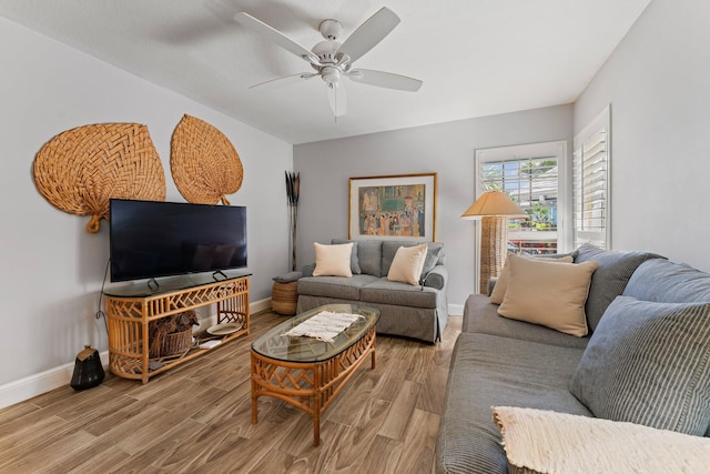 living room with ceiling fan and wood-type flooring