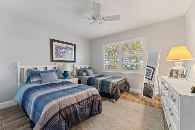 bedroom featuring light hardwood / wood-style flooring and ceiling fan