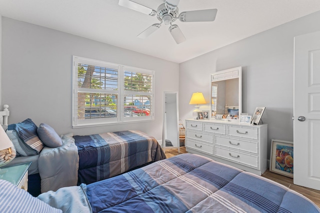 bedroom with ceiling fan and hardwood / wood-style flooring