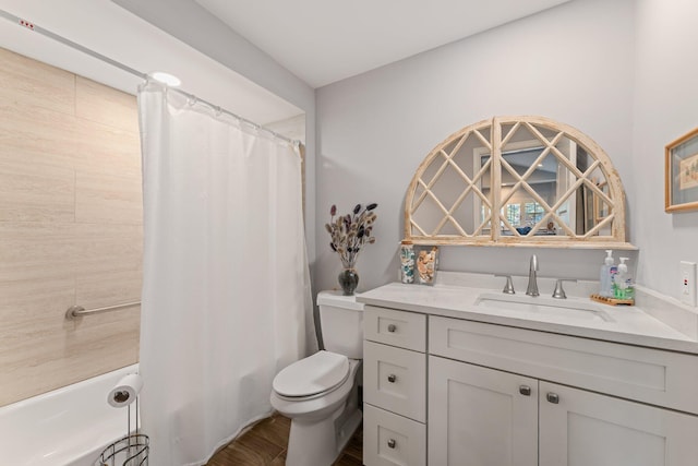 full bathroom with hardwood / wood-style floors, vanity, toilet, and shower / bath combo with shower curtain