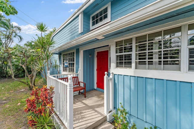 doorway to property featuring covered porch