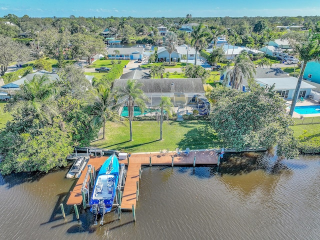 birds eye view of property featuring a water view