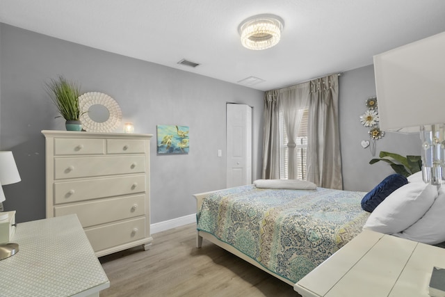 bedroom with light hardwood / wood-style flooring