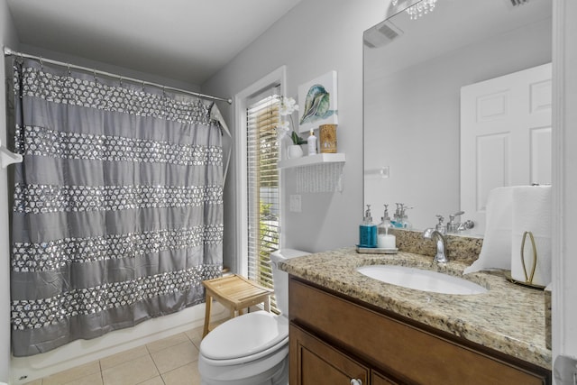 full bathroom featuring tile patterned floors, vanity, toilet, and shower / tub combo with curtain