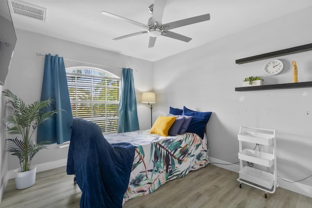 bedroom featuring light wood-type flooring and ceiling fan