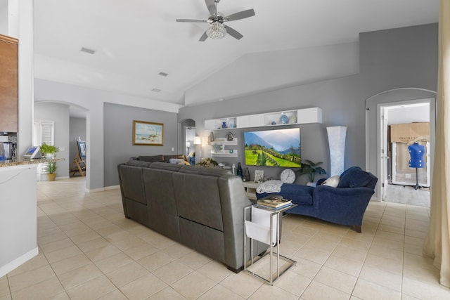 tiled living room featuring vaulted ceiling and ceiling fan