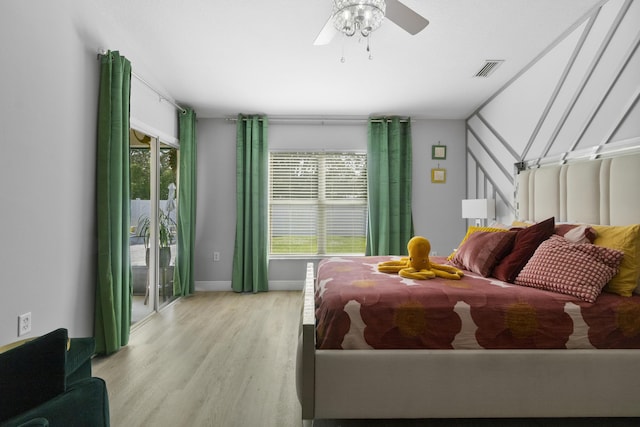 bedroom featuring light hardwood / wood-style floors, multiple windows, and ceiling fan