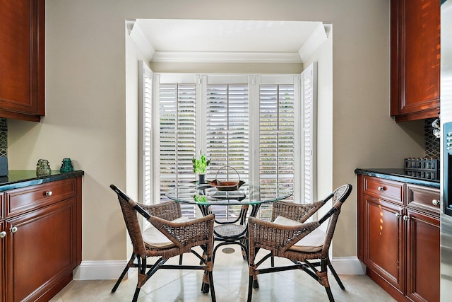 tiled dining area with crown molding