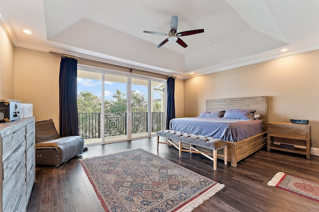 bedroom featuring a tray ceiling, access to exterior, ceiling fan, and dark hardwood / wood-style flooring