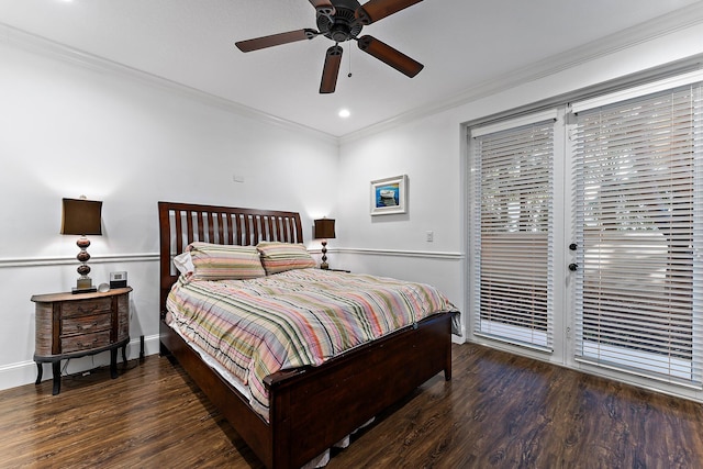 bedroom featuring dark hardwood / wood-style flooring, ceiling fan, and crown molding