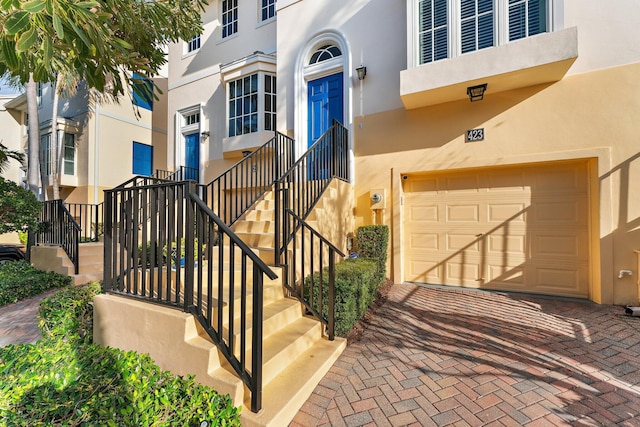 view of exterior entry featuring a garage