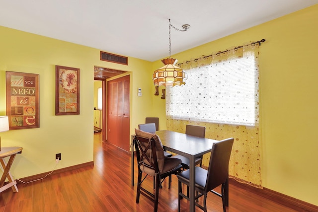 dining room featuring dark wood-type flooring