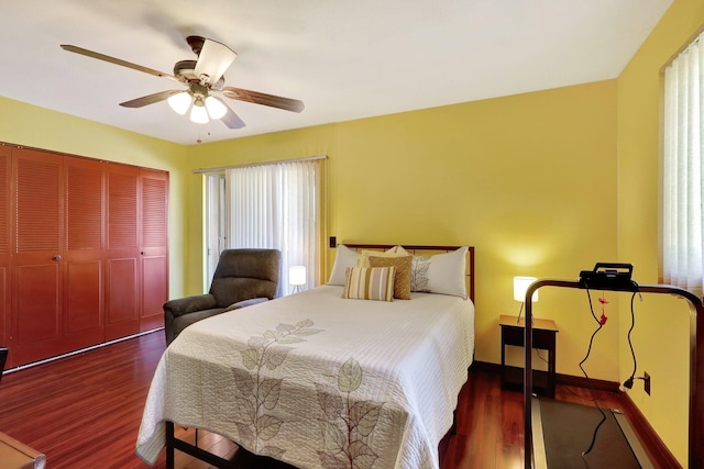 bedroom featuring a closet, ceiling fan, and dark hardwood / wood-style flooring