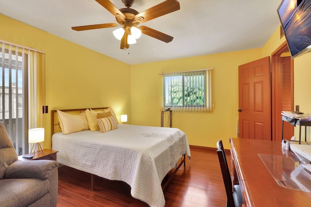 bedroom featuring ceiling fan and dark wood-type flooring