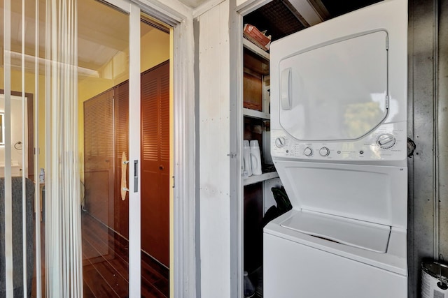 washroom with stacked washer / dryer