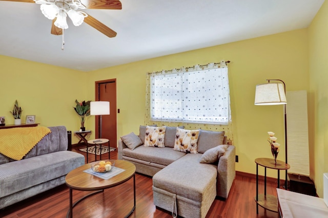 living room with ceiling fan and dark hardwood / wood-style floors