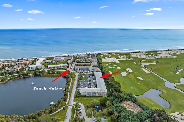 aerial view featuring a water view and a beach view