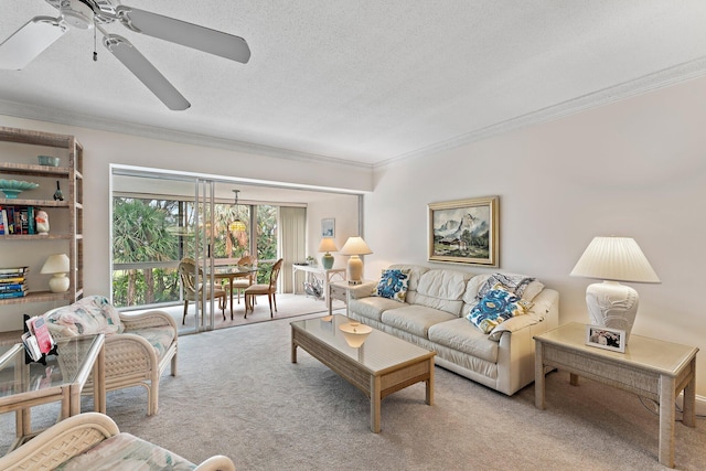 living room featuring a textured ceiling, light colored carpet, ceiling fan, and crown molding