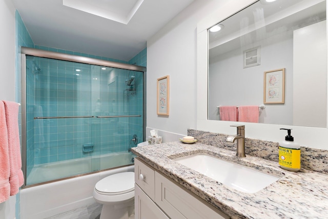 full bathroom with vanity, toilet, and bath / shower combo with glass door