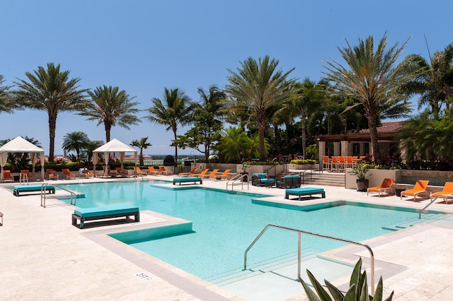 view of swimming pool with a gazebo and a patio area