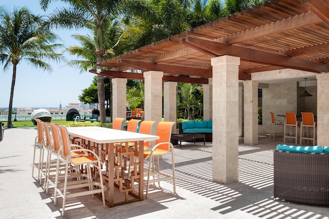 view of patio / terrace with an outdoor hangout area and a pergola