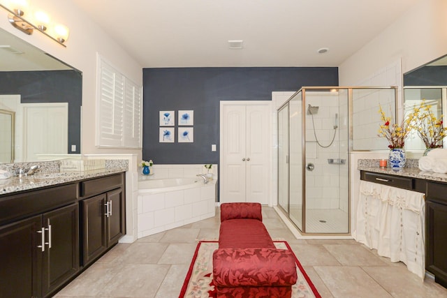 bathroom with separate shower and tub, tile patterned flooring, and vanity