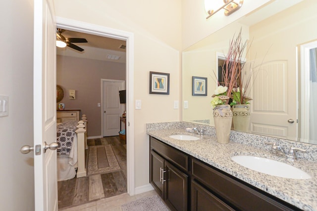 bathroom featuring hardwood / wood-style flooring, ceiling fan, and vanity