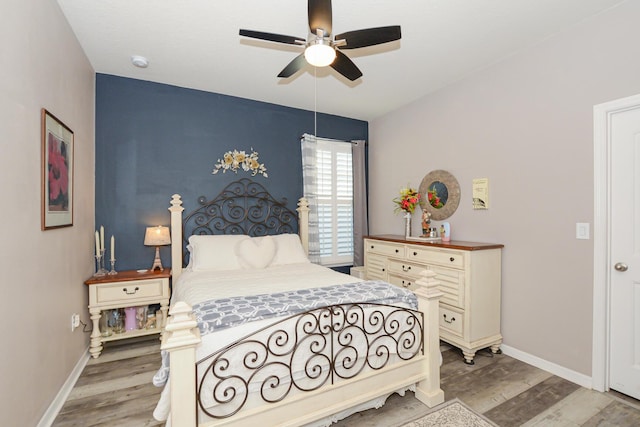 bedroom featuring ceiling fan and light hardwood / wood-style flooring