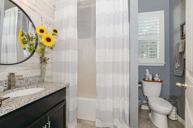 full bathroom featuring tile patterned flooring, vanity, toilet, and shower / tub combo