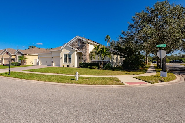 view of front facade with a garage and a front lawn