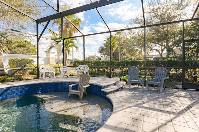 view of patio with a lanai