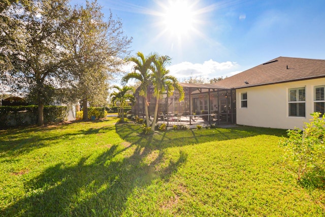 view of yard with a lanai