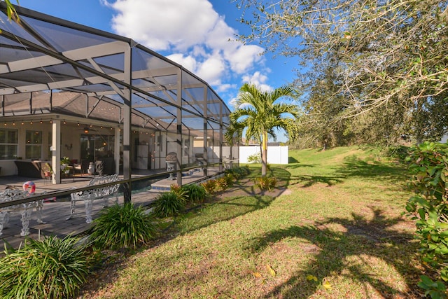 view of yard with a lanai and a patio