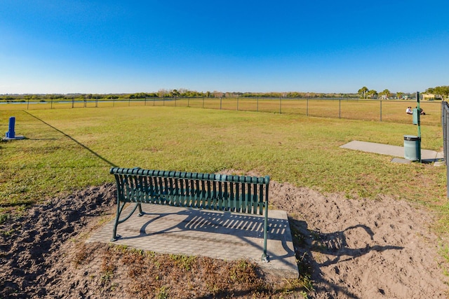 exterior space with a lawn and a rural view