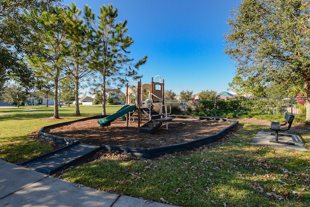 view of jungle gym featuring a lawn